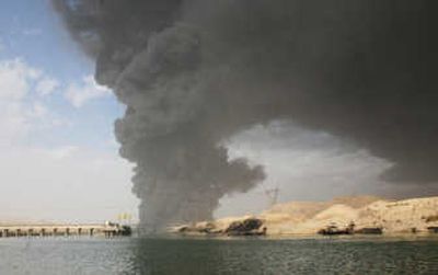 
Smoke rises after a explosive device exploded beneath the strategic oil pipeline in al-Fatha, east of Beiji, in northern Iraq on Friday. Oil continues to flow through the damaged pipe, Iraqi police said.Associated Press
 (Associated Press / The Spokesman-Review)