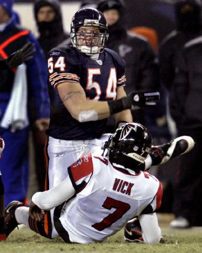 
Bears linebacker Brian Urlacher celebrates a sack of Falcons quarterback Michael Vick on Sunday in Chicago.
 (Associated Press / The Spokesman-Review)
