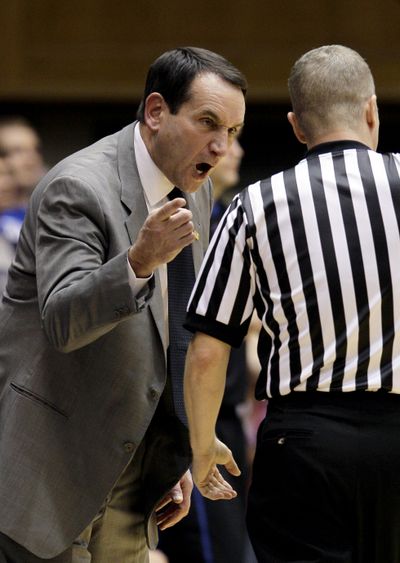 Duke men’s basketball coach Mike Krzyzewski lectures a referee during the first half of his 902nd career win Saturday. (Associated Press)
