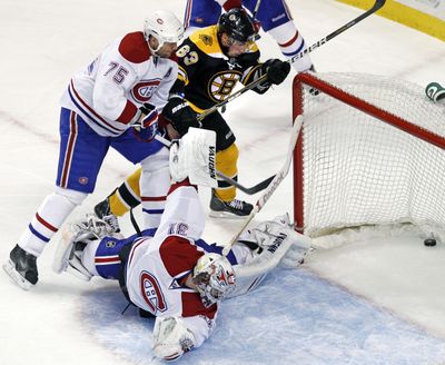 Montreal Canadiens goalie Carey Price turns to see the puck in the net. It was one of seven goals for the Bruins a shutout victory. (Associated Press)