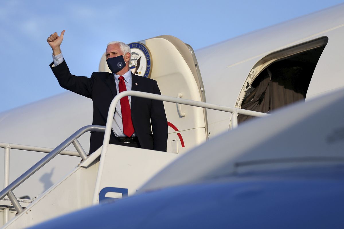 Vice President Mike Pence gives a thumbs-up before departing on Air Force Two from Philadelphia International Airport after a series of stops in Pennsylvania on Thursday, July 9, 2020.  (Tim Tai)