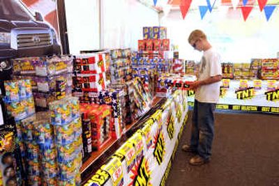 Steve Dreschbach checks out TNT Fireworks in Deer Park on Monday. Laws covering the sale, possession and use of fireworks vary. 
 (Jesse Tinsley / The Spokesman-Review)