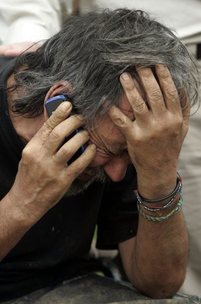 Former hostage Oscar Tulio Lizcano makes a phone call after arriving at a military base in Cali, Colombia, on Sunday.  (Associated Press / The Spokesman-Review)