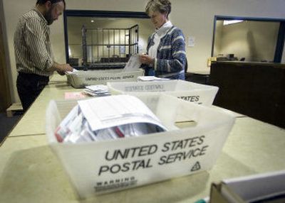 
Mail-in ballots are starting to arrive Friday at the Spokane County elections office. Zack Parazoo and Evelyn Finley presort the first few boxes of ballots. 
 (Christopher Anderson / The Spokesman-Review)
