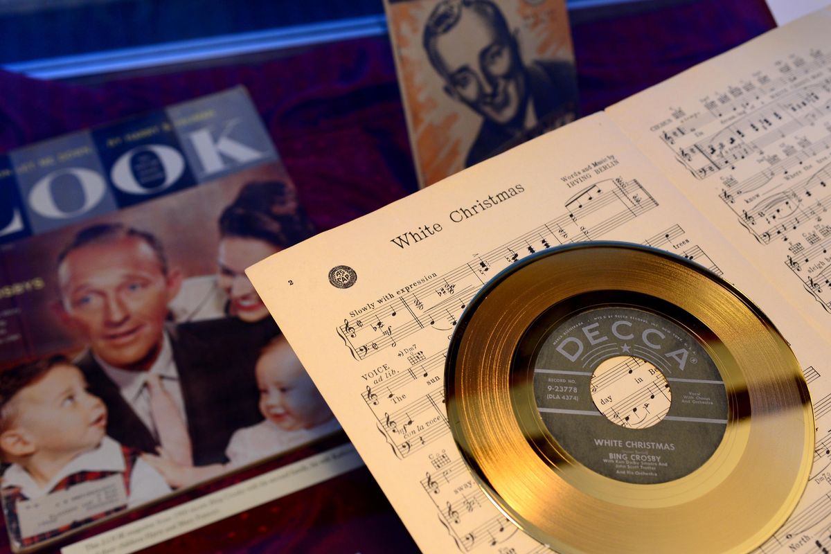 This is the gold record Bing Crosby received for record sales of his song "White Christmas" and the sheet music from when it was first released. These are displayed amidst many other pieces of memorabilia in the Bing Crosby house on the Gonzaga University campus, Monday, Dec. 19, 2016. (Jesse Tinsley / The Spokesman-Review)