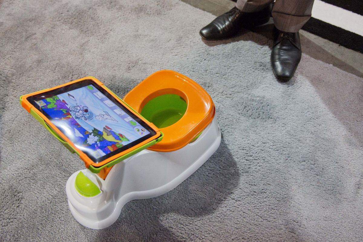 The iPotty for iPad potty training device is seen on display at the Consumer Electronics Show in Las Vegas on Wednesday. No app is available to go with the trainer, but the idea is to keep the child on the toilet for as long as necessary by keeping them digitally entertained. (Associated Press)