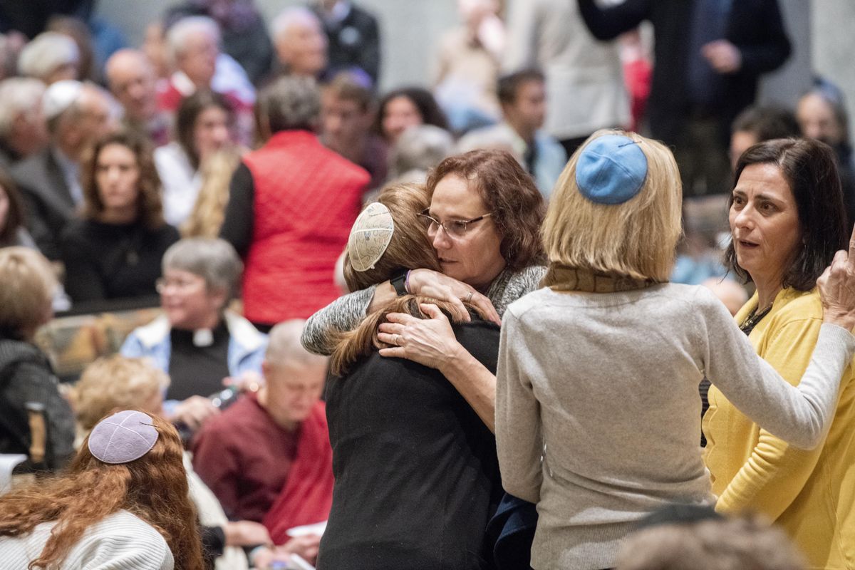 Congregants greet each other before the vigil and remembrance for the slain victims at Tree of Life Synagogue in Pittsburgh, Pennsylvania, Tuesday, Oct. 30, 2018, at Temple Beth Shalom in Spokane. (Jesse Tinsley / The Spokesman-Review)