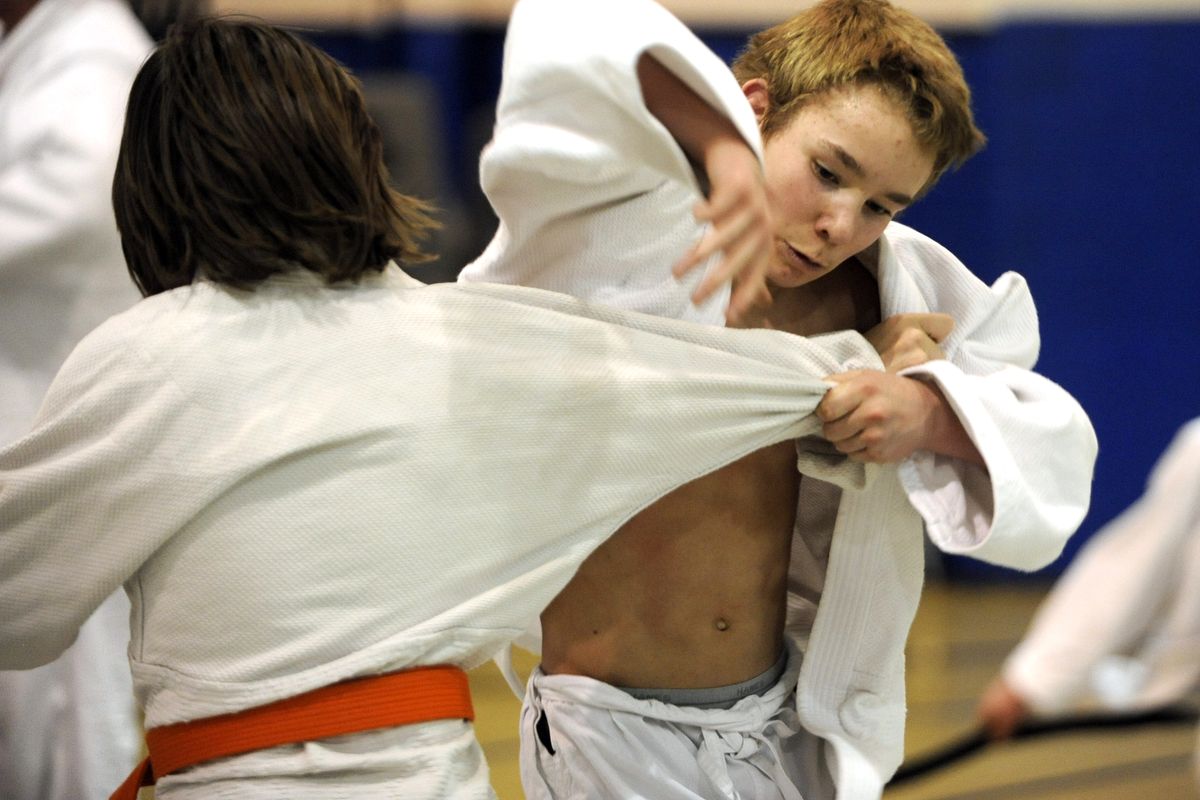 Jesse Kitterman, 14, right, works out with another judo student at the East Central Community Center March 1  during practice with his dojo, Spokane Judo. Kitterman plans to compete in  a national judo competition in Spokane Valley this weekend. (Jesse Tinsley)