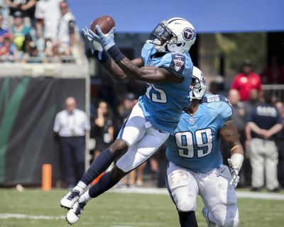 Tennessee Titans cornerback Curtis Riley, left, intercepts a Jacksonville Jaguars pass in front of teammate defensive end Jurrell Casey (99) during the first half of an NFL football game in Jacksonville, Fla., Sunday, Sept. 17, 2017. (Stephen B. Morton / Associated Press)
