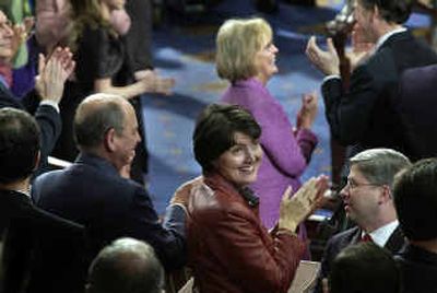 
Fifth Congressional District Representative Cathy McMorris flashes a giant smile toward her parents, brother, grandmother and friends sitting in the gallery Tuesday afternoon on the floor of the U.S. House of Representatives in Washington, D.C., as the members of Congress were sworn in. 
 (Dan Pelle / The Spokesman-Review)
