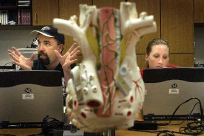 
SCC Echo students David Cornett and Jill Hochstetler prepare for a quiz in their noninvasive cardio training class. A new report says Washington, a net importer of workers with bachelor's degrees, needs to do a better job of producing people trained for high-need jobs. 
 (Brian Plonka / The Spokesman-Review)