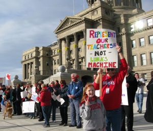 Teachers and supporters ring the state Capitol in protest late Wednesday over passage of legislation restricting their collective bargaining rights and more; the event was one of 14 planned across the state after school on Wednesday. (Betsy Russell)
