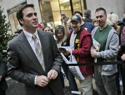 
NASCAR Nextel Cup Champion Jimmie Johnson greets fans Thursday at Rockefeller Center in New York.
 (Associated Press / The Spokesman-Review)