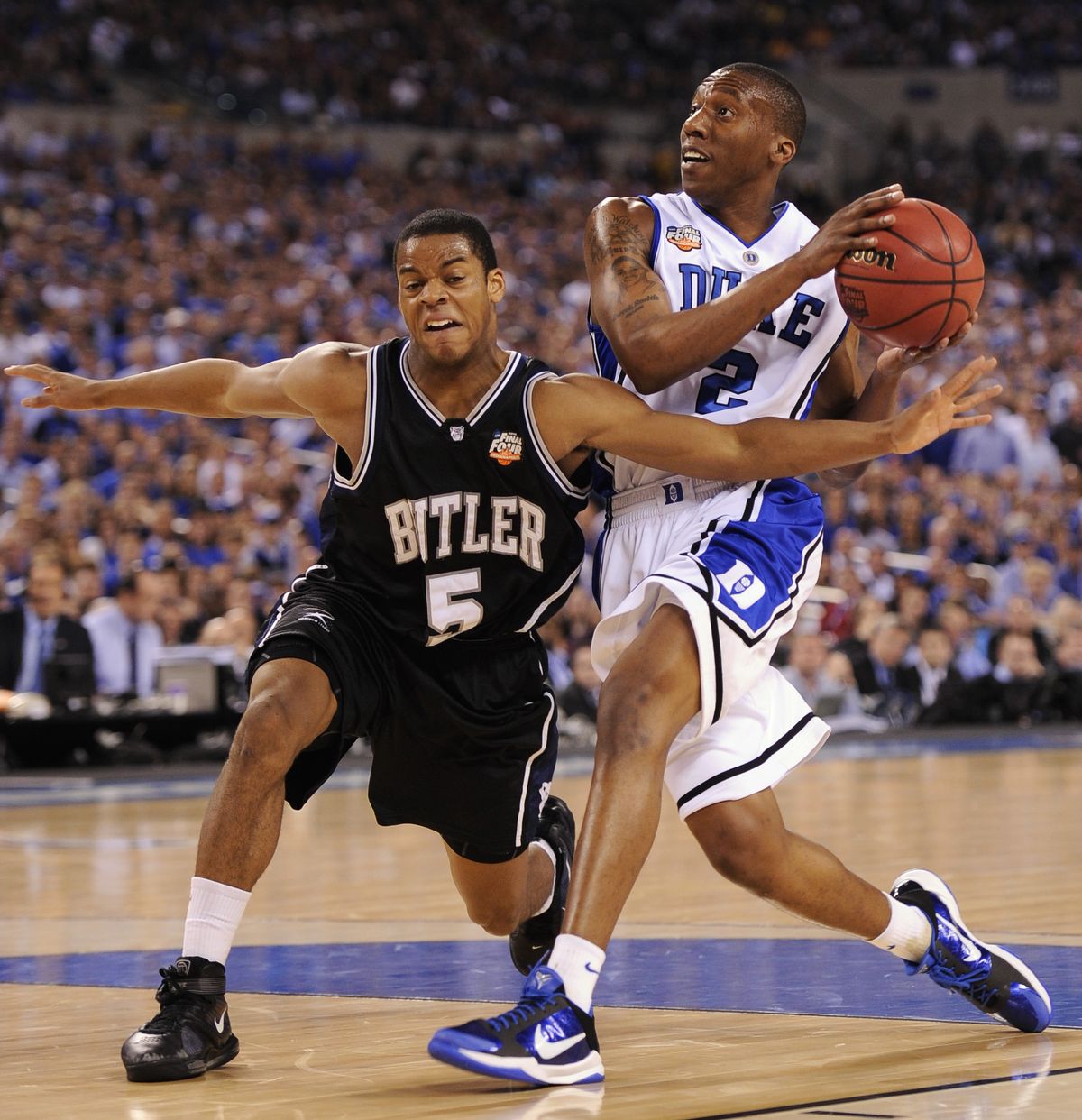 Butler’s Ronald Nored tries to block Nolan Smith’s drive to the basket. Smith was instrumental in Duke’s 61-59 win.  (Associated Press)