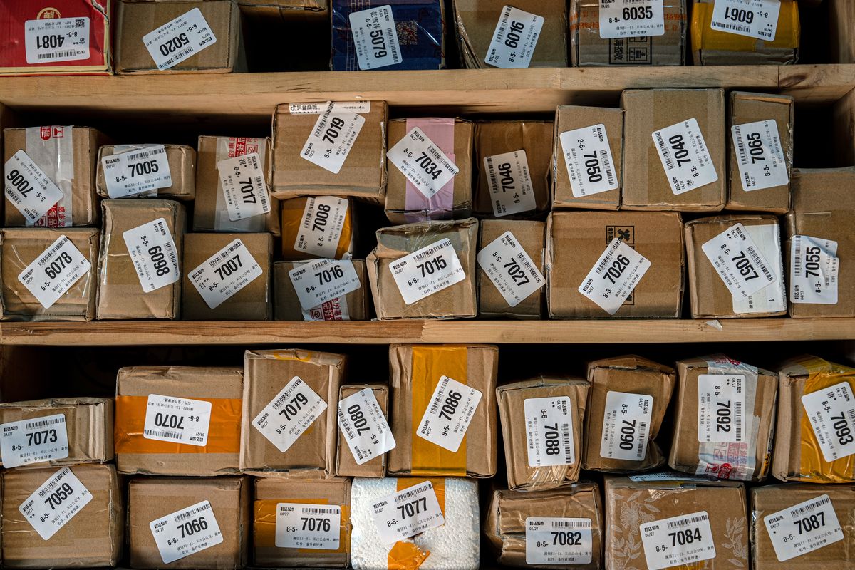 Packages at a neighborhood sorting center in Beijing, China, on Monday. (Na Bian/Bloomberg)