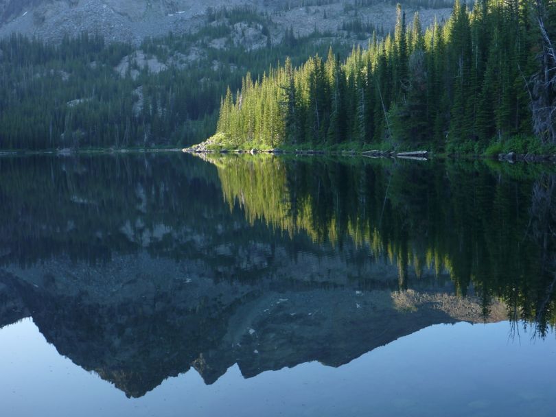 It's morning, and time for trout fishing at Baldy Lake in the Seven Devils Mountains of the Hells Canyon Wilderness. The Idaho Fish and Game Department uses aircraft to stock the lake with 1,000 triploid rainbow fry every three years.