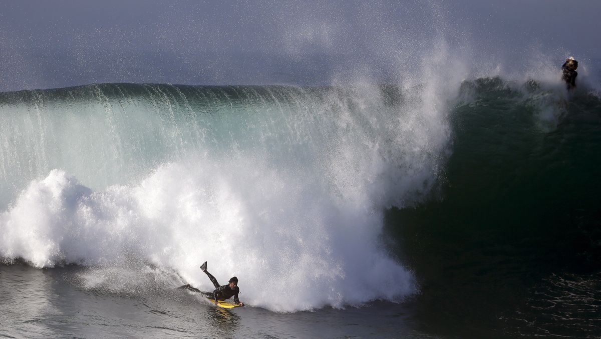A boogie boarder rides a wave at the wedge in Newport Beach, Calif., Wednesday. Southern California beachgoers experienced much higher than normal surf, brought on by Hurricane Marie spinning off the coast of Mexico. (Associated Press)