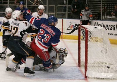 
Buffalo's Ales Kotalik, left, collides with New York Rangers' Karel Rachunek (23) and Sabres goaltender Ryan Miller. 
 (Associated Press / The Spokesman-Review)