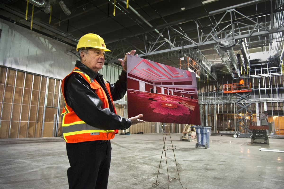 Walt Worthy displays a view of the Davenport Grand’s ballroom while standing in the middle of the room’s construction. (Dan Pelle)