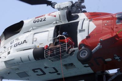 Nick Schuyler is rescued by the U.S. Coast Guard off the coast of Florida.  (Associated Press / The Spokesman-Review)
