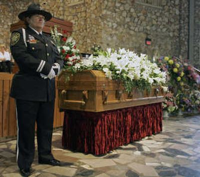 
A member of the North Carolina Honor Guard stands beside the casket of Ruth Graham before a memorial service for her Saturday.Associated Press
 (Associated Press / The Spokesman-Review)