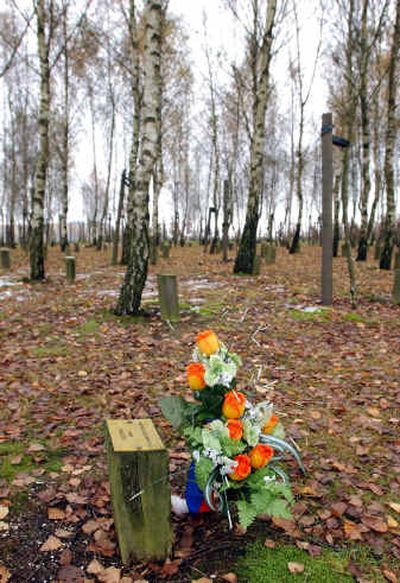 
A dedication plaque and flowers stand among the trees at the peace wood in Bastogne, Belgium. The peace wood, planted in 1994 to mark the 50th anniversary of the Battle of the Bulge, honors veterans and units who returned to the area. A dedication plaque and flowers stand among the trees at the peace wood in Bastogne, Belgium. The peace wood, planted in 1994 to mark the 50th anniversary of the Battle of the Bulge, honors veterans and units who returned to the area. 
 (Associated PressAssociated Press / The Spokesman-Review)