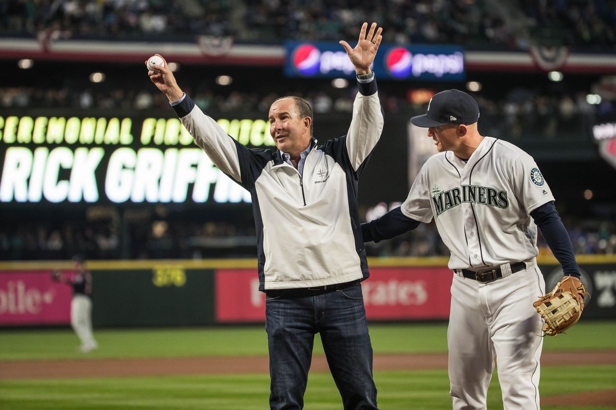 Former M’s trainer Rick Griffin, here with Kyle Seager, threw out the ceremonial first pitch on Opening Day of the 2018 season at the former Safeco Field in Seattle.  (Dean Rutz/Seattle Times)