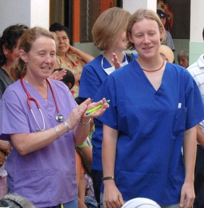 Maj StormoGipson surrounded by patients from about 2008 in Guatemala. (Courtesy photo by Mary Sibulsky)