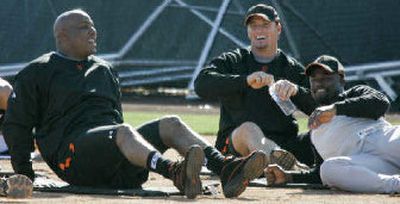 
Barry Bonds, left, and teammates stretch on Tuesday.
 (The Spokesman-Review)
