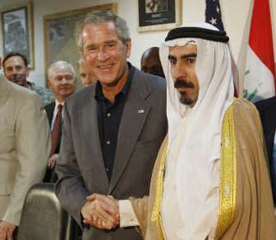 
President Bush shakes hands with Abdul-Sattar Abu Risha, leader of the Anbar Salvation Council,  on Sept. 3. Associated Press
 (Associated Press / The Spokesman-Review)