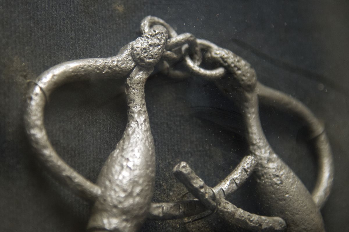 A pair of handcuffs dug from the rubble of the original city jail after the 1889 fire is on display at the Spokane Law Enforcement Museum.