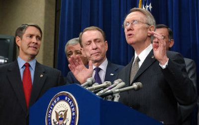 
Senate Minority Leader Harry Reid of Nev., second from right, is joined at a Capitol Hill press conference Thursday by Senate colleagues, from left, Majority Leader Bill Frist of Tenn., Chuck Hagel, R-Neb., Arlen Specter, R-Pa., and Mel Martinez, R-Fla. 
 (Associated Press / The Spokesman-Review)