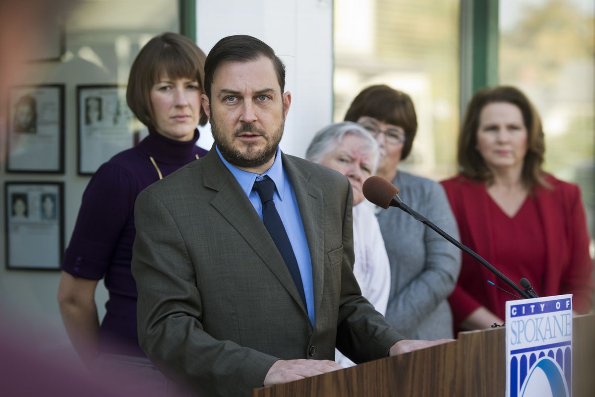 Spokane City Council President Ben Stuckart tells the media Friday at C.O.P.S. West that “I can’t in good conscience vote for Mayor Condon’s proposed 2015 budget.” Behind him are council member Amber Waldref, Chief Garry Park neighborhood co-chair Colleen Gardner and council members Karen Stratton and Candace Mumm. “I can comfortably say ... this budget for a vote today wouldn’t get a single vote,” Stuckart said. (Dan Pelle)