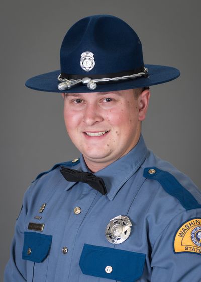 Washington State Patrol Trooper Dean Atkinson Jr. was shot multiple times in the face and hand on Sept. 22 near Walla Walla. Atkinson returned home Sunday after being treated at Harborview Medical Center in Seattle.  (Washington State Patrol)