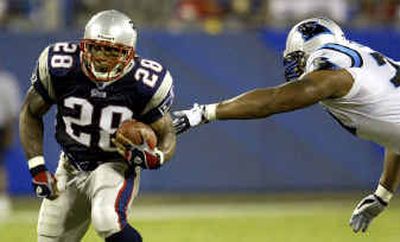 
Corey Dillon gives the Super Bowl champion Patriots a top-notch running back for the first time since Curtis Martin left following the 1997 season. 
 (Associated Press / The Spokesman-Review)