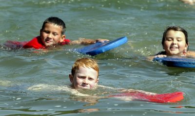 Jared Pendell, 7, center, swims across the swimming area with other beginning swimming students during lessons sponsored by the Medical Lake parks and recreation department. (Jesse Tinsley / The Spokesman-Review)