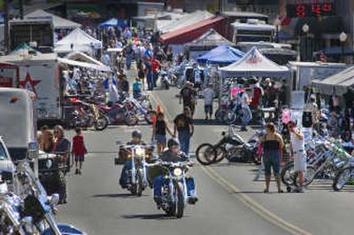 
Two motorcyclists head up the main street of Rosalia after cruising through the 100 Years of Motorcycles Rally in August. 
 (File / The Spokesman-Review)