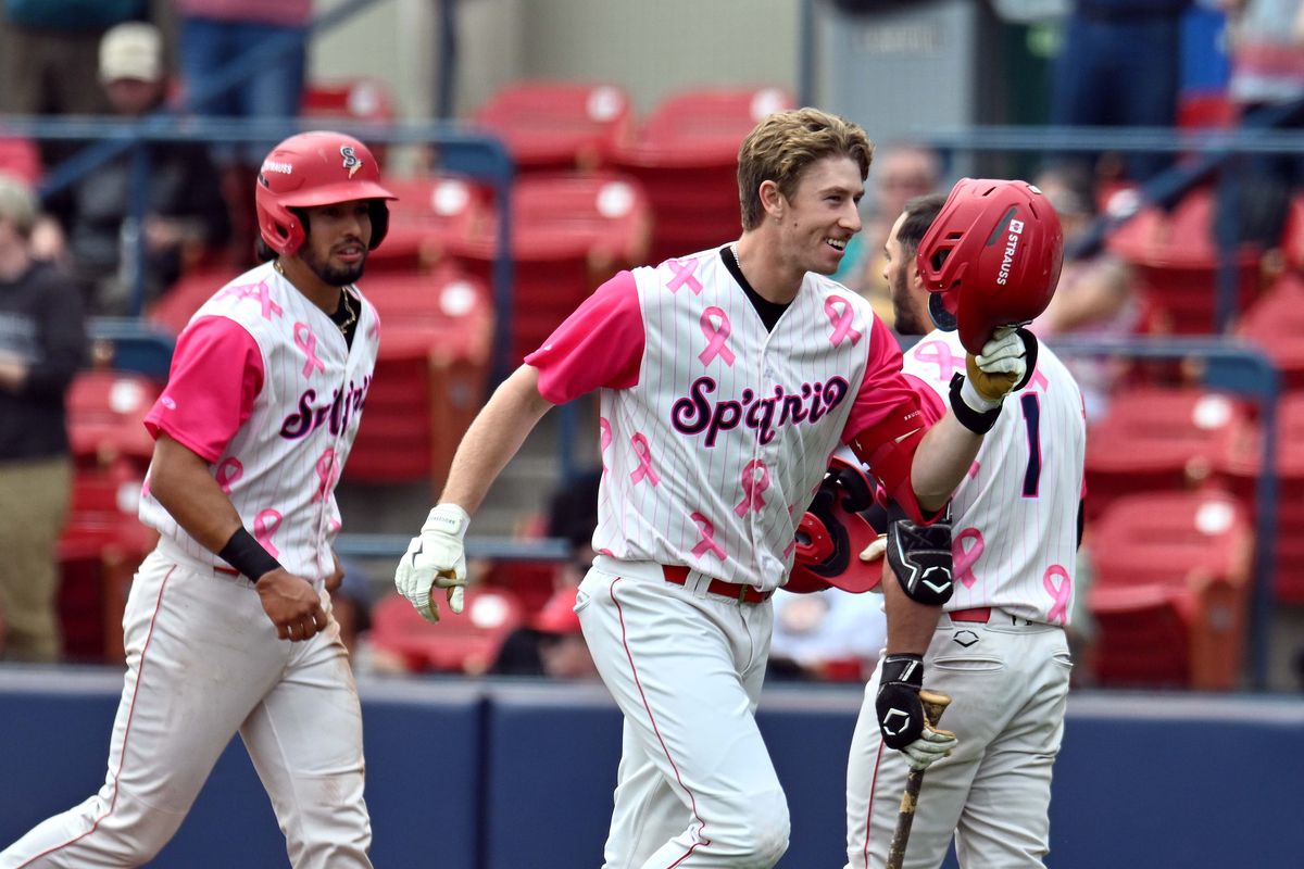Spokane Indians infielder Kevin Fitzer celebrates a second-inning grand slam against the Tri-City Dust Devils on Sunday at Avista Stadium. (James Snook)