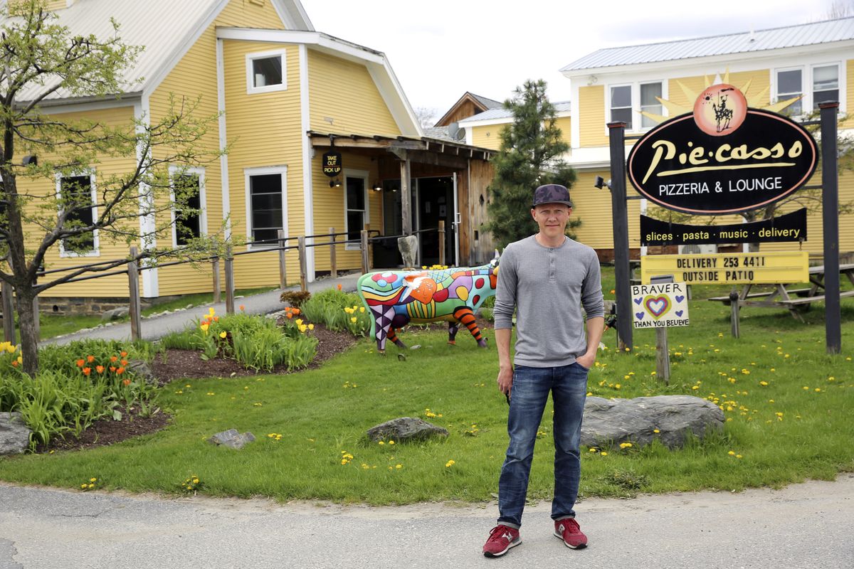 Eduardo Rovetto poses outside his restaurant Piecasso Pizzeria &amp; Lounge in Stowe, Vt., on Saturday, May 8, 2021. Rovetto says he would like to hire between 15 and 20 workers before what is expected to be a busy summer tourist season, but he’s not getting enough interest. Similar complaints are heard across the country and many states, including Vermont, are beginning to push those who lost jobs during the pandemic back into the workforce.  (Wilson Ring)