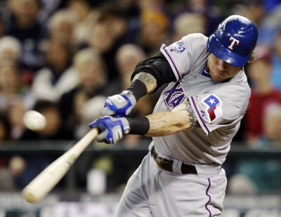 Josh Hamilton slugged 43 homers and drove in 128 runs with a .285 average for Texas last season. (Associated Press)