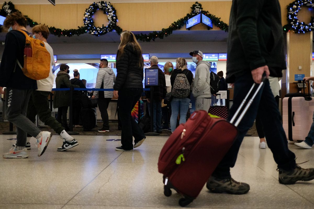Travelers head to their gates on Thursday, Nov 18, 2021, at Spokane International Airport in Airway Heights, Wash.  (Tyler Tjomsland/The Spokesman-Review)