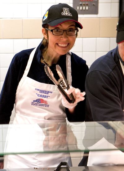 U.S. Rep. Gabrielle Giffords, D-Ariz., serves a Thanksgiving meal at Davis-Monthan Air Force Base on Thursday in Tucson, Ariz. (Associated Press)