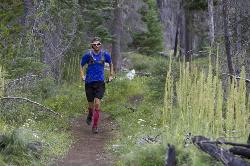 Joe McConaughy strides down the Pacific Crest Trail while approaching a checkpoint close to Big Lake near the Santiam Pass en route to running the length of the trail from Mexico to Canada in record time.

 (Andy Tullis / The (Bend) Bulletin)