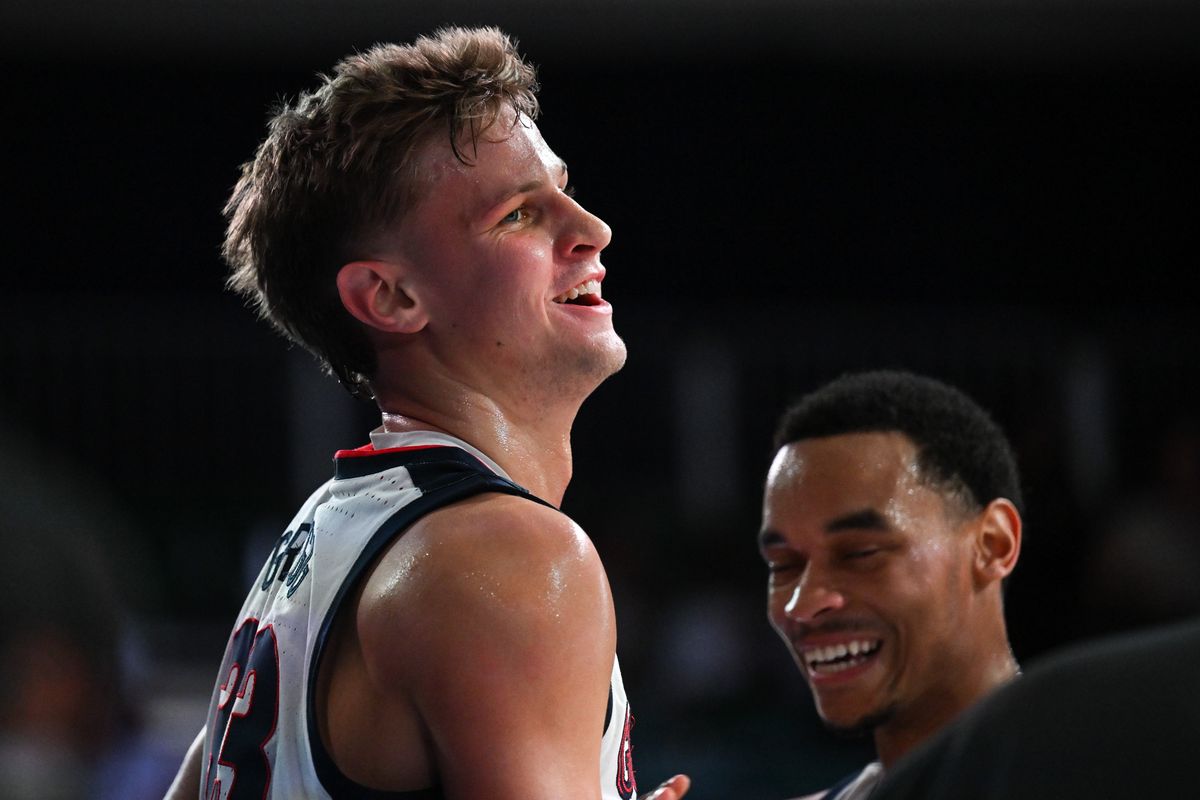 Gonzaga Bulldogs forward Ben Gregg (33) smiles as guard Nolan Hickman (11) laughs during the second half of a college basketball game against the Davidson Wildcats on Friday, Nov. 29, 2024, at Paradise Island, Bahamas. Gonzaga won the game 90-65.  (TYLER TJOMSLAND)