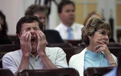 
Dennis Ferguson listens with his wife, Lois, to testimony Friday during the governor- election trial in Chelan County Superior Court in Wenatchee.
 (Associated Press / The Spokesman-Review)