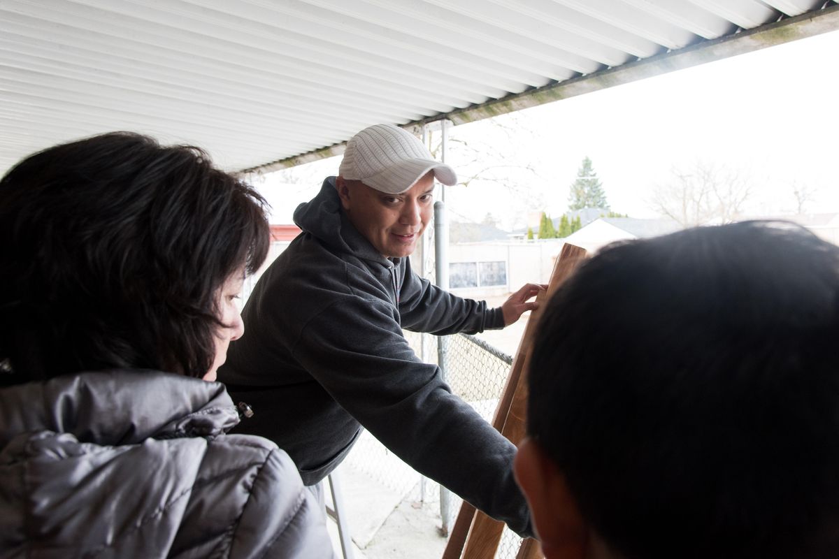 Shawn Brigman shows off different types of paddles made from cedar wood on  April 3. Brigman helped a group of Salish School students, faculty and parents build a Salishan Sturgeon Nose Canoe over spring break. (Eli Francovich / The Spokesman-Review)