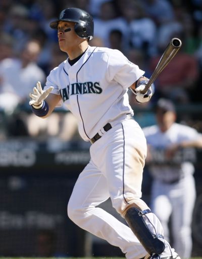Kenji Johjima watches his solo home run in the eighth inning. (Associated Press / The Spokesman-Review)