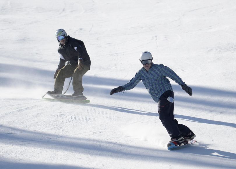 Snowskaters on the slopes at Silver Mountain Resort in February 2015. (Jesse Tinsley / The Spokesman-Review)