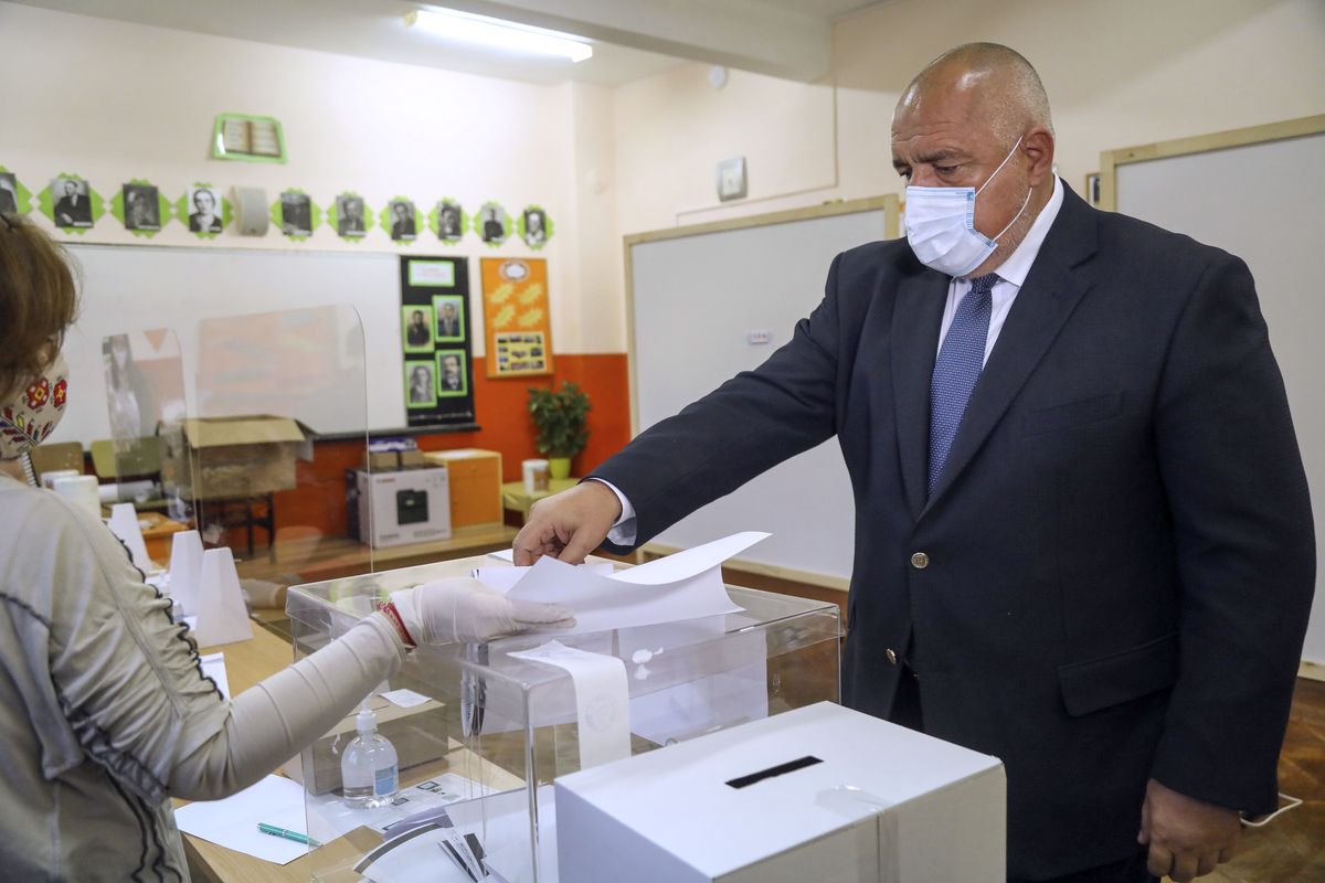In this photo released by the GERZB Party, Bulgarian Prime Minister Boyko Borissov casts his ballot during parliamentary elections in the town of during the parliamentary elections in the town of Bankya, Bulgaria, Sunday, April 4, 2021. Bulgarians are heading to the polls on Sunday to cast ballots for a new parliament after months of anti-government protests and amid a surge of coronavirus infections.  (Handout)
