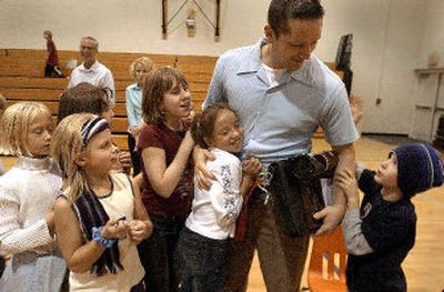 
Tim Marks, a third-grade teacher at Fernan Elementary in Coeur d'Alene, is congratulated by his students. 
 (Jesse Tinsley / The Spokesman-Review)